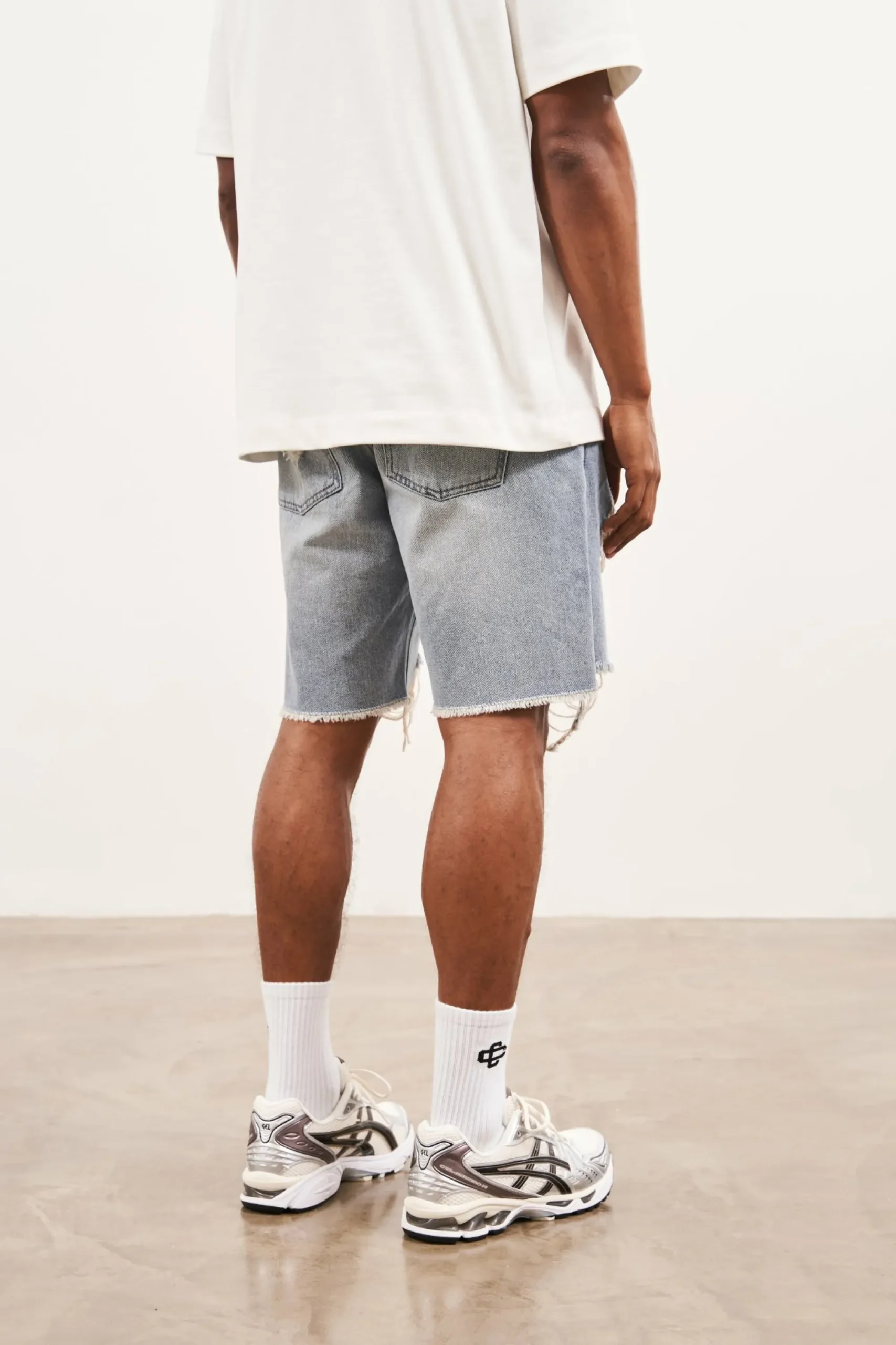 distressed_raw_hem_denim__3-1.webp The Couture Club Shorts-Distressed Raw Hem Denim Shorts