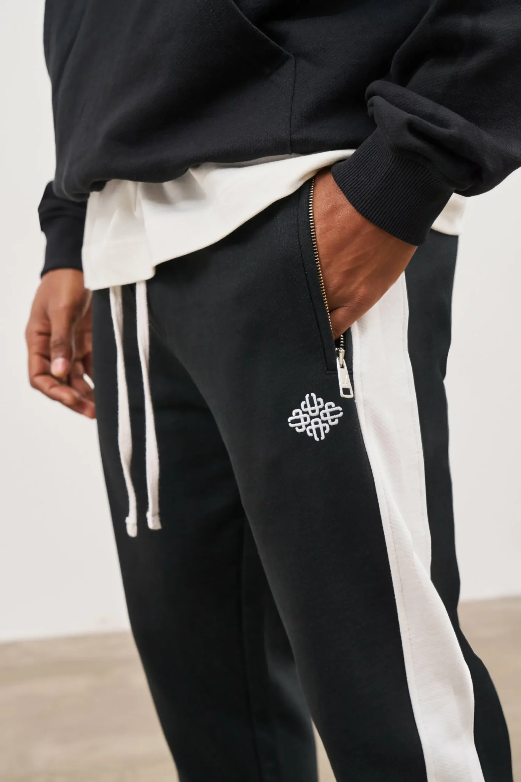emblem_side_panel_split_h_3-1.webp The Couture Club Bottoms-Emblem Side Panel Split Hem Joggers