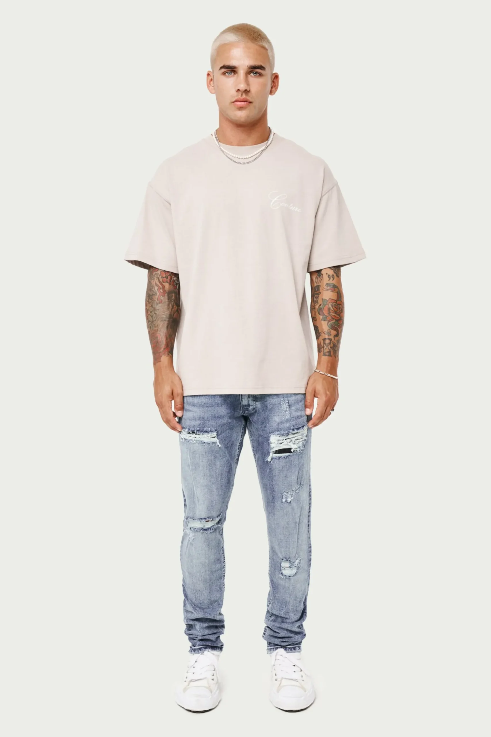 rip_and_repair_stacked_je_2-1.webp The Couture Club Bottoms-Rip And Repair Stacked Jeans