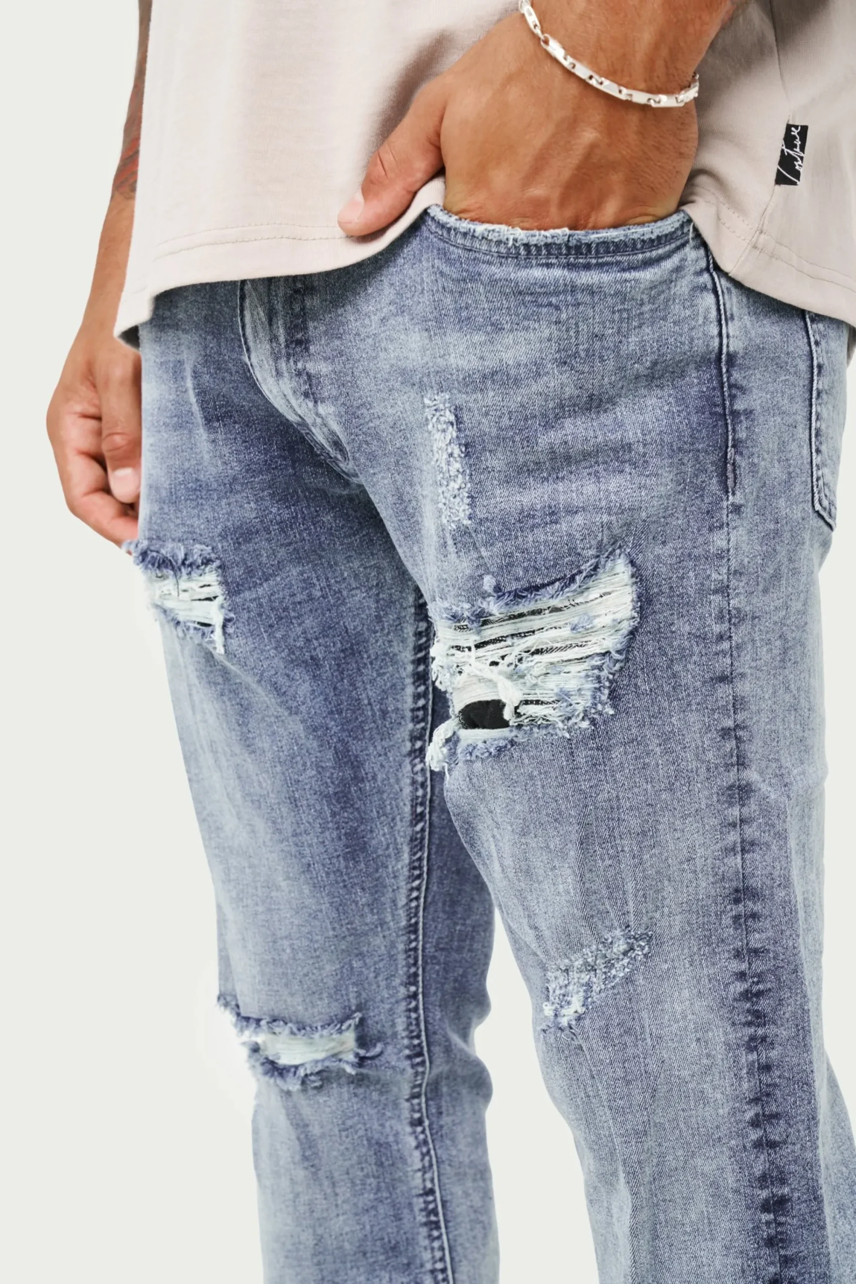rip_and_repair_stacked_je_3-1.webp The Couture Club Bottoms-Rip And Repair Stacked Jeans
