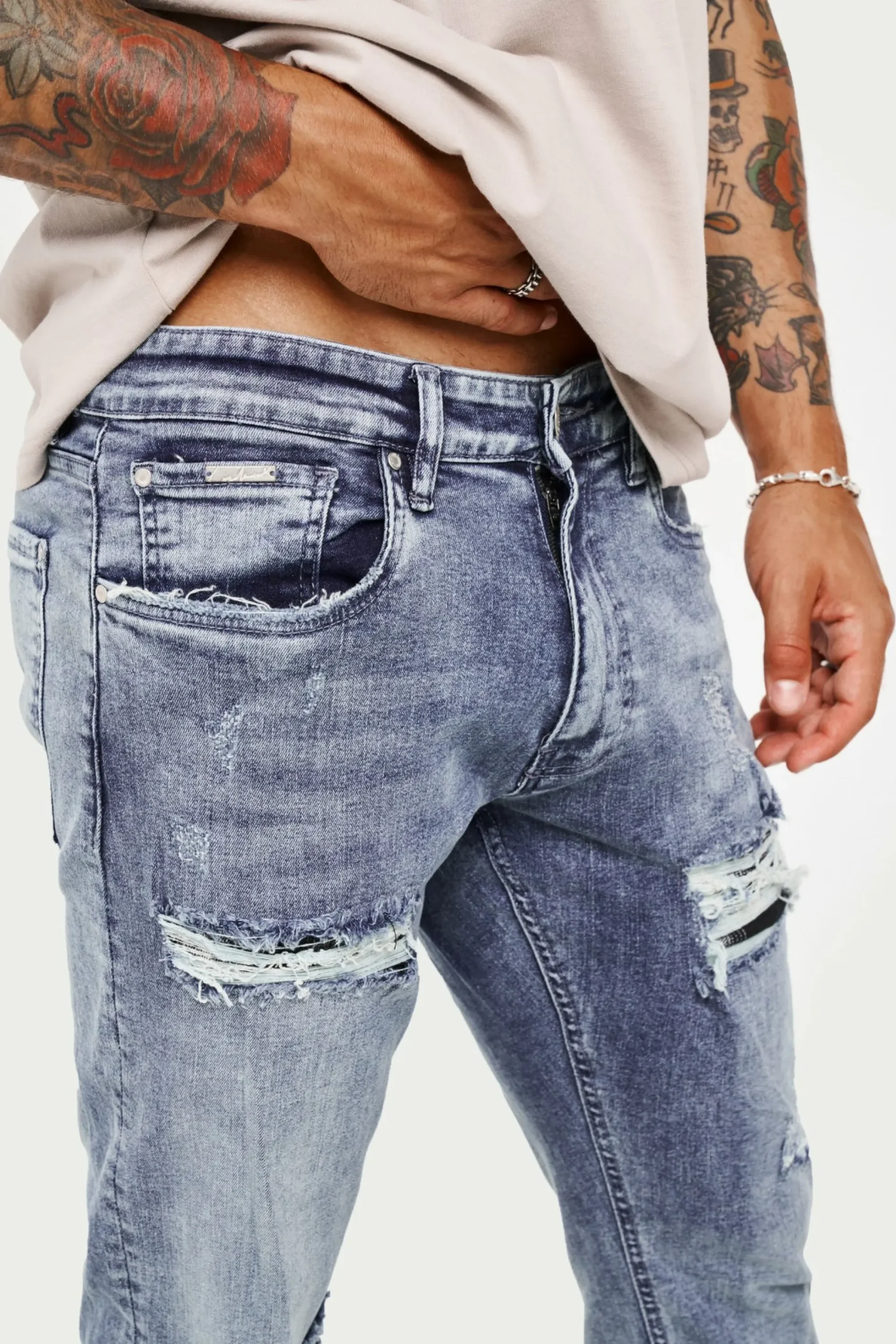 rip_and_repair_stacked_je_4-1.webp The Couture Club Bottoms-Rip And Repair Stacked Jeans